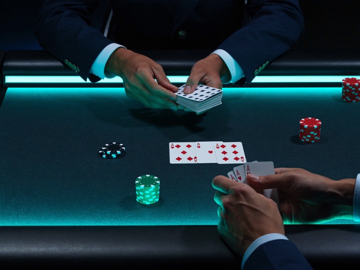 Evolution baccarat dealer at the table